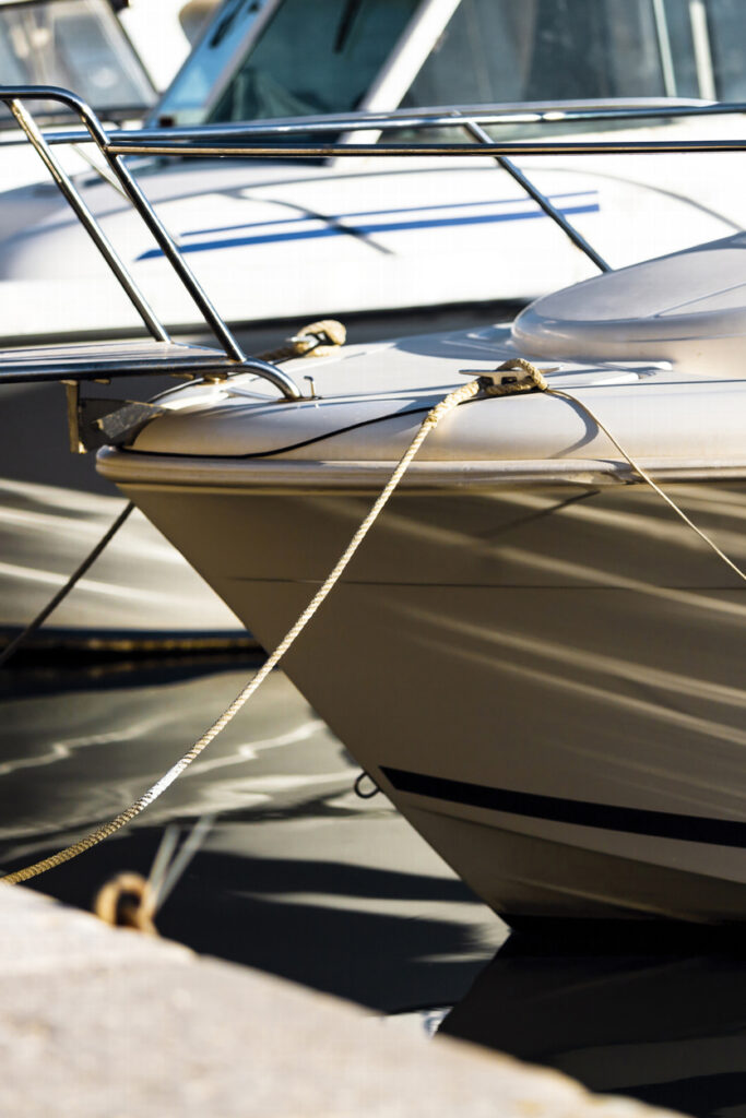Motorboat bows moored at a marina